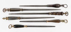 Six assorted antique sharpening steels including three examples by F. Dick, 19th century, the largest 53cm long