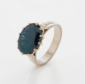 A 9ct white gold ring, set with large oval blue sapphire, stamped "9ct", 6.6 grams total