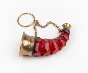 An antique ruby glass cornucopia chatelaine scent bottle with gilt metal mounts and original glass stopper, 19th century, 7cm long