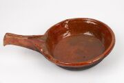An antique Dutch terracotta cooking pan, 17th century; together with a Siegburg stoneware jug, 15th century, (2 items), the jug 25cm high - 6