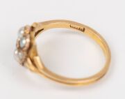 An antique 18ct gold ring, set with five seed pearls and white diamond, 19th century,&nbsp; ​​​​​​​2.9 grams - 3