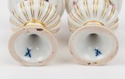 MEISSEN&nbsp;pair of antique German floral porcelain miniature urns and a pair of candlesticks, 19th century, (4 items), blue crossed sword marks to the bases, the largest 13cm high - 3