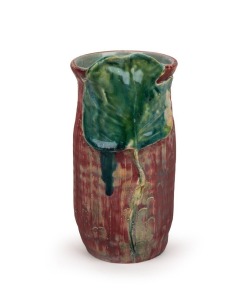 PHILIPPA JAMES burgundy pottery vase with applied leaf decoration,  incised " Phillipa James", 16cm high 