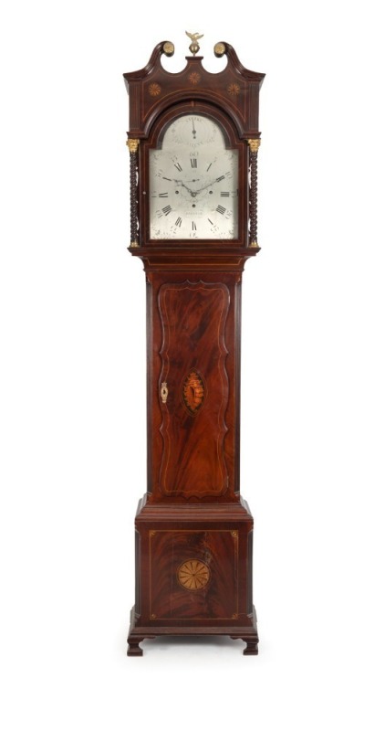 HENRY LANE [THE CONVICT CLOCK MAKER FROM BRISTOL]. Antique longcase clock with one piece silvered dial, marked "HENRY LANE BRISTOL", in Sheraton mahogany case with conch shell inlay to the serpentine edged trunk door. Three train weight driven movement ch