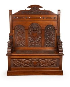 Circle of ROBERT PRENZEL Australian blackwood hall seat with carved griffin and face mask decoration, early 20th century, 138cm high x 115cm wide x 41cm deep