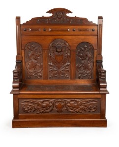 Circle of ROBERT PRENZEL Australian blackwood hall seat with carved griffin and face mask decoration, early 20th century, 138cm high x 115cm wide x 41cm deep