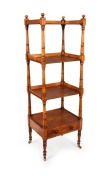 A rare Australian figured huon pine four tier wotnot with single drawer and well turned tapering column supports on brass castors, Tasmanian origin, circa 1840, 138cm high, 46cm wide, 38cm deep