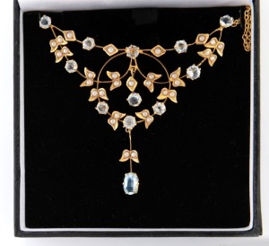 An antique Australian 9ct yellow gold, aquamarine, white stone and seed pear negligee necklace, early 20th century, crown mark to reverse, pendant section 7cm wide, 7 grams total