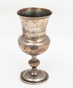 An antique silver trophy cup, engraved "Presented To Henry J. Ibbottson Esq. by John Henry Wilton as a slight token of the gratitude he felt for the kindness and attention paid him in the time of danger and distress, November 1847"", later weighted base and damage to stem, 16.5cm high