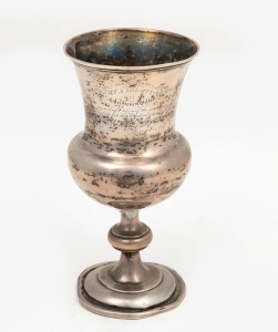 An antique silver trophy cup, engraved "Presented To Henry J. Ibbottson Esq. by John Henry Wilton as a slight token of the gratitude he felt for the kindness and attention paid him in the time of danger and distress, November 1847"", later weighted base a