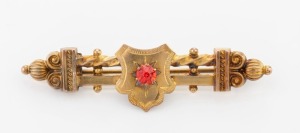 WILLIS & SONS of Melbourne antique Australian 9ct yellow gold brooch adorned with red stone, 19th century, stamped "9" flanked by pictorial marks, 6cm wide, 3.6 grams