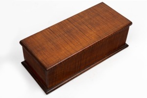 An antique Australian fiddleback blackwood glove box, circa 1900, 10cm high, 30cm wide, 134cm deep