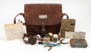 UPPER YARRA RIFLE CLUB presentation brown leather kit bag, fitted with cartridge compartments and accessories, bearing silver plaque "Upper Yarra Rifle Club Scratch Championship, Won By N.E. FLEMING, 1954-1955", 28cm wide