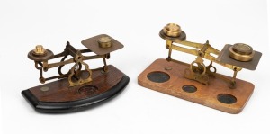 Two sets of scales with assorted weights, 19th/20th century, ​​​​​​​the larger 19cm wide