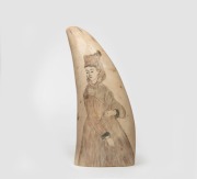 A scrimshaw whale's tooth with engraved female portrait with remains of hand-coloured finish, ​​​​​​​13cm high