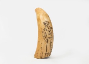 A scrimshaw whale's tooth with naive portrait of a sailor, 11.5cm high