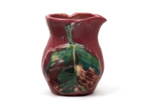 PHILLIPPA JAMES pink glazed pottery jug with applied gumnuts and leaf, incised "Philippa James", 7.5cm high