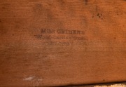 An Australian Arts & Crafts bookcase with knee hole desk compartment, manufactured in American oak, carved with Illawarra flame tree motif, early 20th century, with original ink stamp to the reverse of drawer "MISS GETHERS, WOOD CARVING STUDIO, SYDNEY", 1 - 5