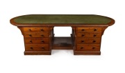 An impressive antique Australian library partners desk with D-ended inset writing surface and&nbsp;crossbanded edge. The pedestals with four graduated drawers to each side standing on a recessed plinth with footrest, circa 1880. Full cedar construction. 66cm h