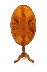 An antique New Zealand specimen wood oval tilt-top occasional table with carved tripod base, 19th century, 70cm high, 79cm wide, 56cm deep