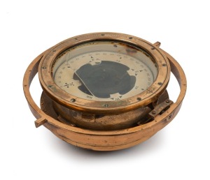 An American WWII period brass gimbal wet compass, stamped "The Lionel Corporation, 1944", 14cm high, 34m wide