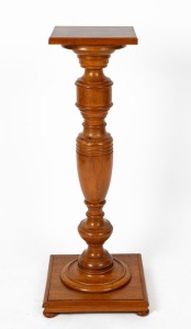 An Australian solid maple pedestal with baluster trunk, square top, conforming base and bun feet, circa 1910, 103cm high, 40cm wide, 40cm deep, (square top 29 x 29cm)