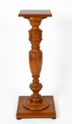An Australian solid maple pedestal with baluster trunk, square top, conforming base and bun feet, circa 1910, 103cm high, 40cm wide, 40cm deep, (square top 29 x 29cm)