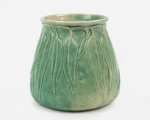 MELROSE WARE light green glazed pottery vase of tapering form with gum leaf decoration, 15cm high, 15cm wide