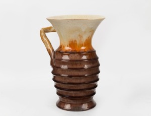 REMUED brown and cream glazed pottery vase with orange highlights, adorned with branch handle and ribbed decoration, incised "Remued", 20cm high