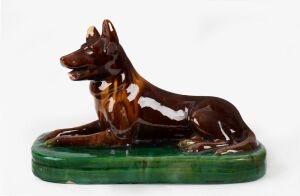 McHUGH Kelpie dog pottery doorstop, incised "McHugh Tasmania", 23cm high, 34cm long