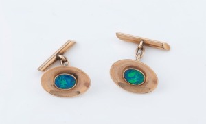 A pair of vintage 9ct rose gold oval cufflinks, each set with an oval opal, circa 1920, 5.3 grams total