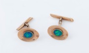 A pair of vintage 9ct rose gold oval cufflinks, each set with an oval opal, circa 1920, ​​​​​​​5.3 grams total