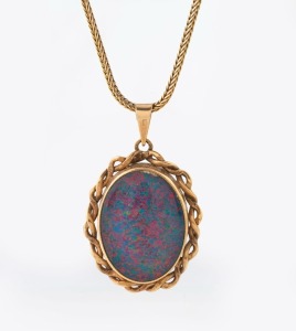 A vintage 9ct gold and opal doublet pendant, suspended on a 9ct gold chain, 20th century, the pendant 3cm high including bow, the chain 44cm long, 9.3 grams total