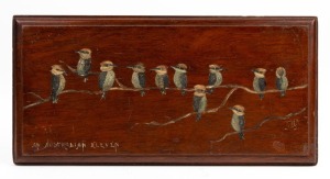 An Australian folk art hand-painted timber panel with kookaburras, titled "AN AUSTRALIAN ELEVEN", signed lower right "F.M.B. 1911", 20 x 40cm overall