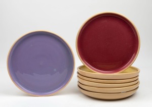 ALLAN LOWE set of seven harlequin coloured pottery plates, all incised "Allan Lowe", 24cm diameter