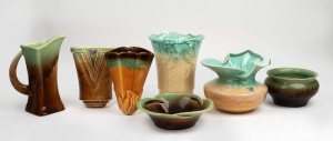 Seven assorted green and brown glazed pottery vases, wall pockets and a jug, by NEWTONE and TRENT, ​​​​​​​the largest 23cm high