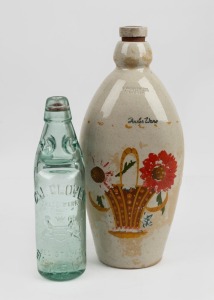 A glass ginger beer bottle stamped "C. J. GLOVER, BENDIGO"; together with a FOWLER WARE pottery bottle, (2 items), 23.5cmm and 32cm high