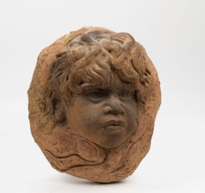 WILLIAM RICKETTS pottery wall plaque of a child's face, incised "Wm. Ricketts, Australia", 27cm high