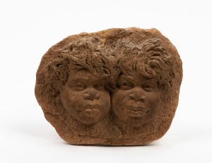 WILLIAM RICKETTS pottery wall plaque adorned with two Aboriginal faces, incised "Wm. Ricketts", 15cm high, 19cm wide