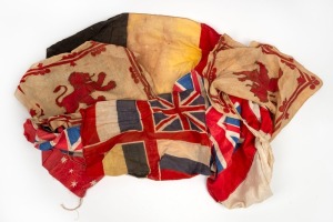 WW1 ERA flags/bunting of various sizes, strung together for display on shop-front or house; a bit weathered, but a fascinating group. (8 flags).