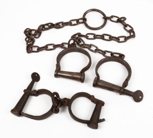 Replica leg irons and handcuffs, 20th century, (2 items), the leg irons 128cm long