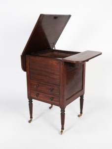 An antique Colonial gentleman's cedar washstand with drop sides and fluted legs, early 19th century. Origin unknown. Note: Several alterations visible. 82cm high, 53cm wide (closed), 58cm deep