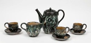 JOHN PERCEVAL pottery teapot with sgraffito decoration, together with matching jug, tea cups and saucers, (10 items), all incised "Perceval", the teapot 21cm high