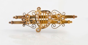 SIMONSEN of Melbourne antique 15ct gold brooch with Irish harp decoration adorned with seed pearls, 19th century, stamped "15" flanked by pictorial marks, 5.3cm wide, 5.3 grams