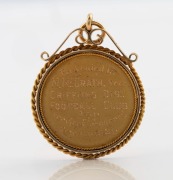 An antique 15ct gold football medallion, inscribed "Presented to M McGrath&nbsp;Sec Griffiths Dist. Football Club For Services Rendered Season 1921", 4.5cm high including bow, 11.6 grams - 2