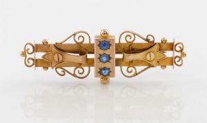 An antique Australian 9ct gold bar brooch, set with three blue stones, Melbourne origin, late 19th century, stamped "9" flanked by pictorial marks, 5.5cm wide, 4.7 grams