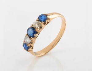 JOHNSON & SIMONSEN of Melbourne 18ct gold ring, set with blue sapphires and diamonds, stamped "18" flanked by pictorial marks,  2.6 grams 