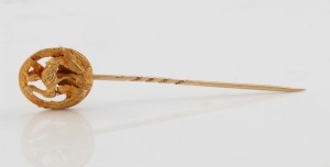 An antique Australian yellow gold emu stickpin, 19th/20th century, top section tests as 20ct gold, the pin tests as 14ct gold. 8.5cm long, 8.7 grams