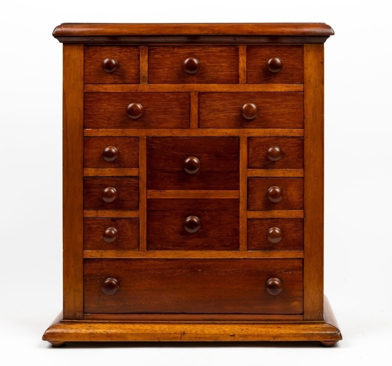 An antique Australian cedar apprentice chest of thirteen drawers in unusual configuration, 19th century, inscribed "Jack Davies Made This", 44cm high, 40cm wide, 23cm deep