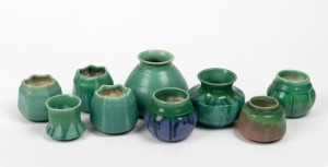 MELROSE WARE group of nine assorted green glazed pottery vases, one example with blue highlights, the largest 10.5cm high